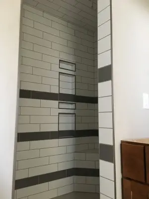 subway tile shower in white — Carpet Installation project by Mel's Carpet Outlet
