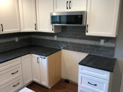 updated kitchen cabinetry and backsplash — Kitchen Remodeling project by Spencer Remodeling
