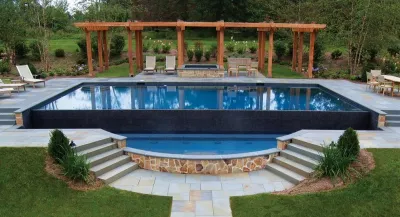 Infinity Edge Pool and Patio — Landscape Design project by Bosenberg And Company Landscape Architects