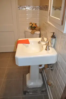 Compact main level restroom — Kitchen Remodeling project by Luxury Bath Remodeling