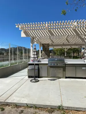 Ultimate Outdoor Living: Pool Enhancement with Trellis and Kitchen — Custom Home Builders project by Empey, Inc. Custom Home Contractors