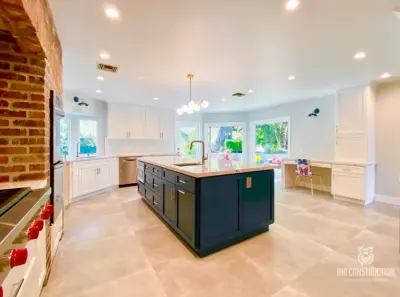 Stunning Mid-Century Kitchen Renovation Featuring an Accent Brick Wall by IND Construction — Custom Home Builders project by IND Construction, LLC
