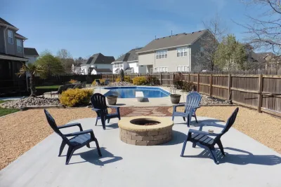 Patio & Fire Pit by the Pool by Dr. Dan's Landscaping & Architectural Design