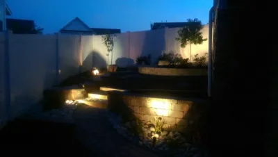 Retaining Wall with a Walkway and Patio by Dreamscape Designers Landscape Company