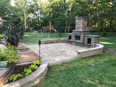 Patio With Water Features and Fireplace — Landscape Construction project by Dreamscape Designers Landscape Company in Suffolk