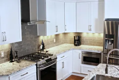 Classic White Kitchen with Curved Island — Kitchen Remodeling project by Stone Kitchens