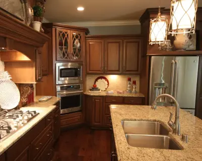 Cozy Cherry Kitchen Featuring a Black Island — Kitchen Remodeling project by Walters Cabinets, Inc.
