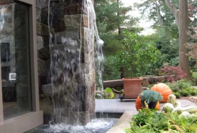 Manhasset Residence with Stone Waterfall — Landscape Construction project by Emil Kreye & Son Inc.