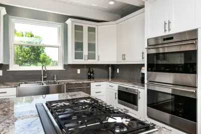 Elegant White Kitchen — Kitchen Remodeling project by More Brothers Construction
