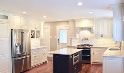 Accent Stove Hood, Tile, and Pot Filler in White Kitchen — Kitchen Remodeling project by Rothgangel Cabinetry And Home Improvement