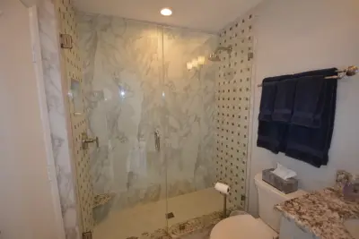 Marble White Bathroom — Kitchen Remodeling project by The Bath And Kitchen Gallery, Inc.