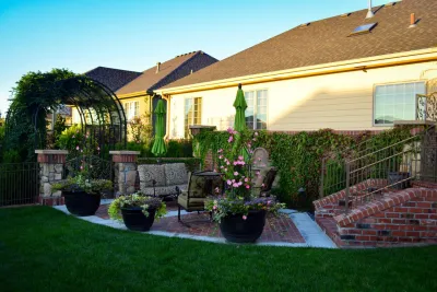French Country Corner lot Courtyard by Breaking Ground