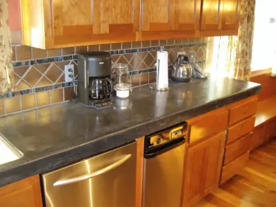 Gourmet Kitchen Renovation with Stunning Design and Walk-in Pantry by V-Builders