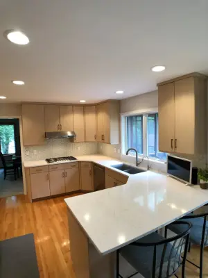 Kitchen Renovation with Glass Tile and Full-Height Quartz Backsplash — Home Renovation & Remodeling Services project by D & L Construction