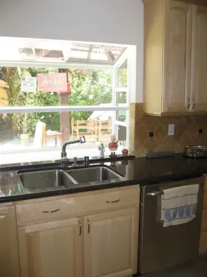 Kitchen Renovation / Flooring Installation / Sliding Door Upgrade by Precision Home Design & Remodeling