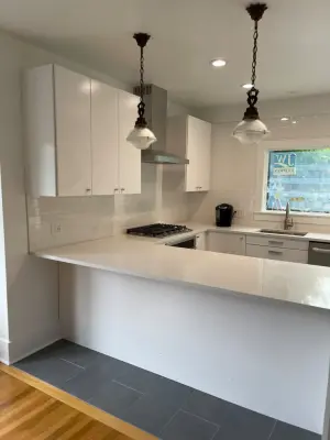 The "Dream Kitchen for Entertainers" | The Waterfall Quartz and Brick Design — Home Renovation & Remodeling Services project by Marbs Renovation