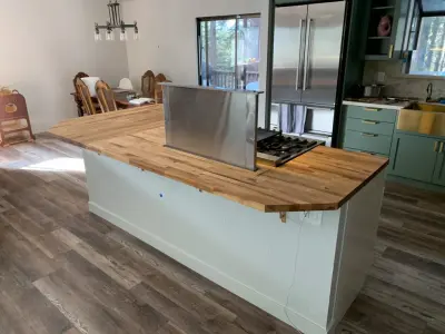 Wooden Countertops in a Kitchen with White and Sage Green Cabinets — Home Renovation & Remodeling Services project by Lake Tahoe Construction Services, INC.