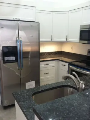 White Cabinet Kitchen Renovations — Home Renovation & Remodeling Services project by Powell's Pro Building And Remodeling, Inc.