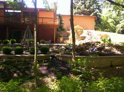 koi pond with waterfall feature — Home Renovation & Remodeling Services project by Buckeye Beauty Landscaping & Excavating