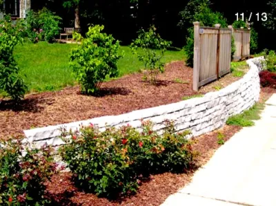 Stone Wall Fence and Garden by Ganshert Nursery & Landscapes