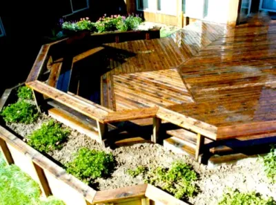 Dark Wooden Deck with Bench — Landscape Construction project by Ganshert Nursery & Landscapes