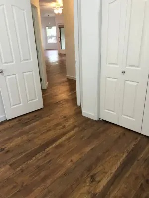Seamless Laminate Flooring and Baseboards Without Transition Strips — Home Renovation & Remodeling Services project by Phoenix Remodeling LLC