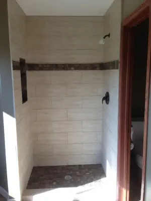 Expansive Subway Tile Shower — Home Renovation & Remodeling Services project by Home Preservation Specialists Inc