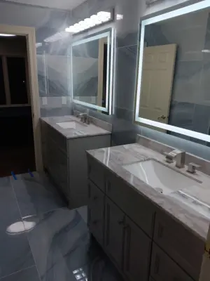 Aqua-hued Restroom — Home Renovation & Remodeling Services project by G Remodeling