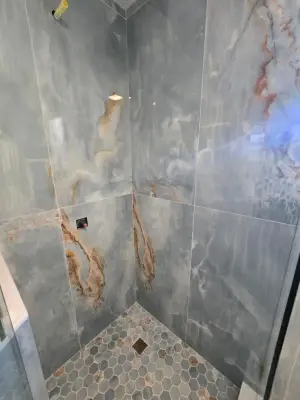 Opulent Teal Marble Shower Design — Home Renovation & Remodeling Services project by Level Up Construction & Investment Group LLC