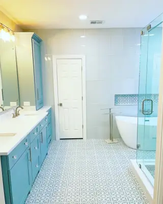 Bathroom with glass tiles by Amy's Paint And Remodeling Solutions