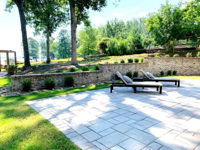 Concrete Patio with Brick Retaining Wall — Landscape Construction project by Grayscape Landscape & Design LLC