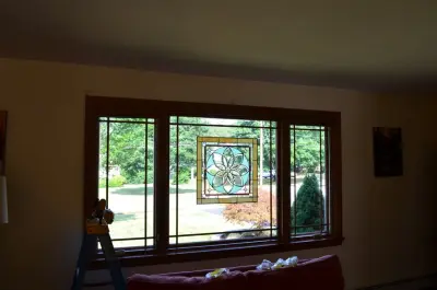 Living Room Transformation Featuring Picture Window by A & J Interiors, LLC