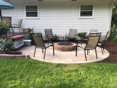 Brick Patio with Firepit by Green Concepts Landscaping