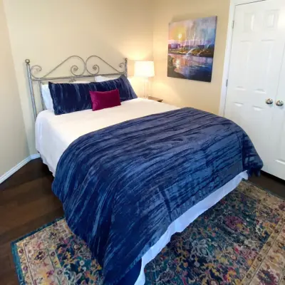 Crimson and Azure Sleeping Space — Interior Design & Decorating project by Rooms Reimagined