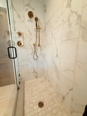 Colorado Bathroom with Travertine Flooring and Porcelain Marble Finish — Interior Design & Decorating project by Becca Robbins Interior Design