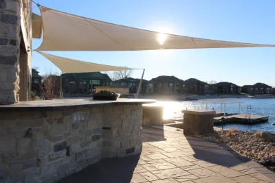 Lakeside Contemporary Entertainment area w/ multiple fireplaces and sun sails — Landscape Construction project by Groundscapes, Inc.