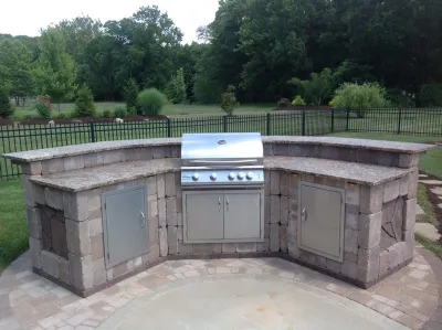 Outdoor Kitchen and BBQ by Hackman Lawn & Landscape