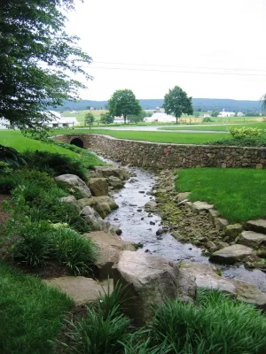Natural Stone Terraces Support Walks and Patio with Meadow Garden — Landscape Construction project by Hanselman Landscape And Gardens in Morgantown