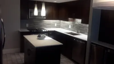 Kitchens Featuring Dark Wooden Cabinets by Design By Kimberly Vaughan