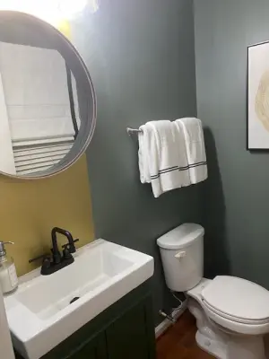 Chic and Minimalist Powder Room by Creative Interior Designs By Lynda LLC