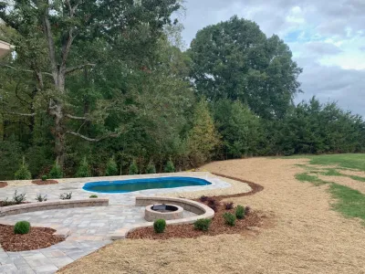 Backyard Pool with Fire Pit — Landscape Construction project by High Rock Land & Hardscapes in Summerfield
