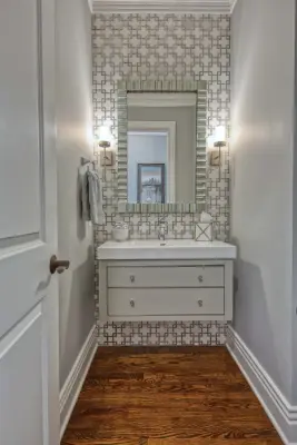 2019: A Powder Room with Tiled Accent Wall by Lisa Lynn Designs Home Store & Design Studio