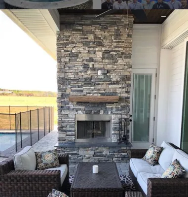 Lanai with Outdoor Fireplace by Hyer Quality Hardscape & Landscape