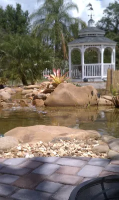 Large Koi Pond with TN River Rounds — Landscape Construction project by IDigPonds.com & Desired Landscapes LLC