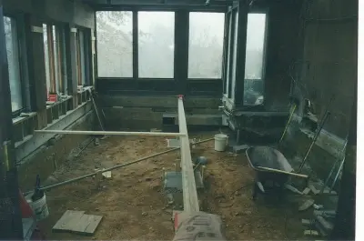Transforming an indoor garden space into a formal dining area by Butler Restorations LLC