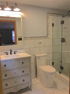 Renovating a bathroom with an expansive shower — Custom Cabinets & Cabinetry project by Butler Restorations LLC