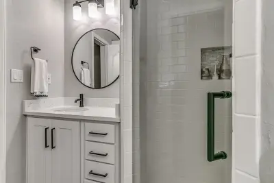 Modern White Bathroom — Custom Cabinets & Cabinetry project by Baths And Rooms By Denise