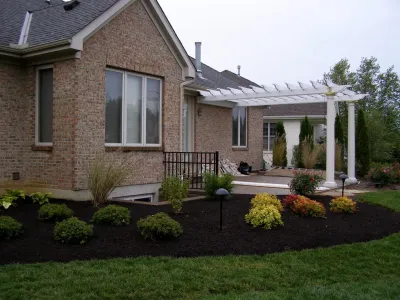 Patio with Pergola by J.R. Thomas Landscaping, Inc.
