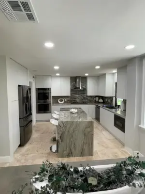 Quartzite Slab Door Kitchen — Custom Cabinets & Cabinetry project by Build That Way