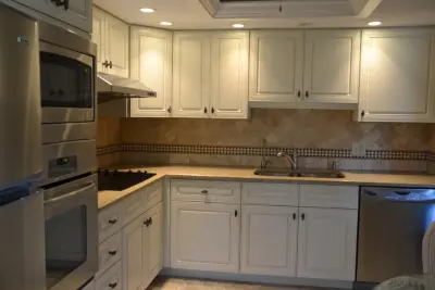Custom Countertops and Stone Tile Backsplash — Custom Cabinets & Cabinetry project by Cornerstone Builders Of SWFL